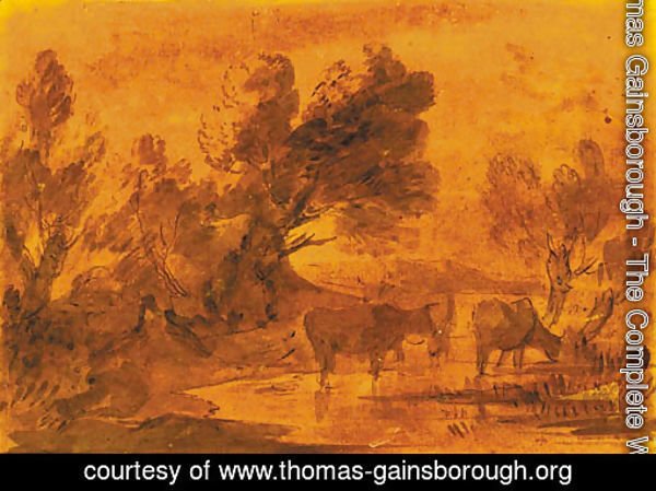 Cattle watering in a wooded landscape